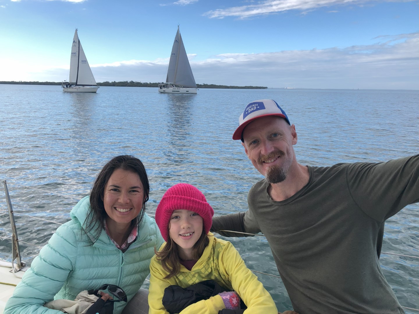 Emelie, Dani and Jon with yachts in the background